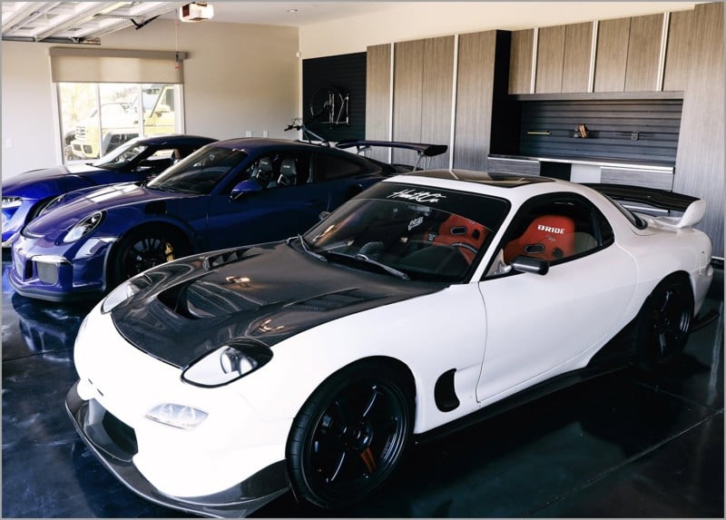 JT Hunt’s prize automobiles rest on a custom epoxy floor